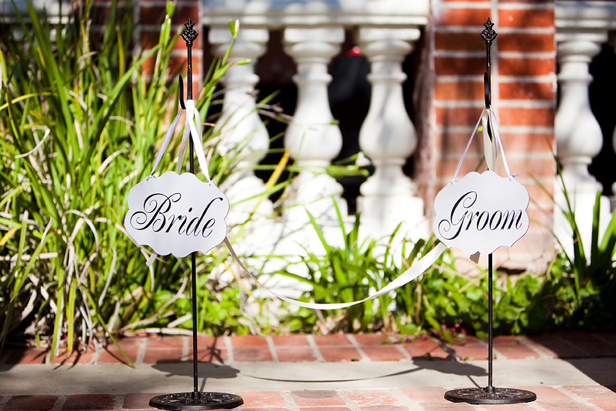 bride and groom signs in vista de oro wedding