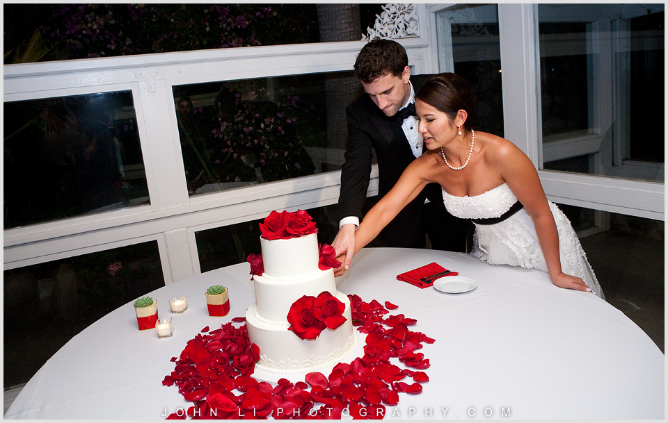 cake cutting in Rancho De Las Palmas wedding reception 