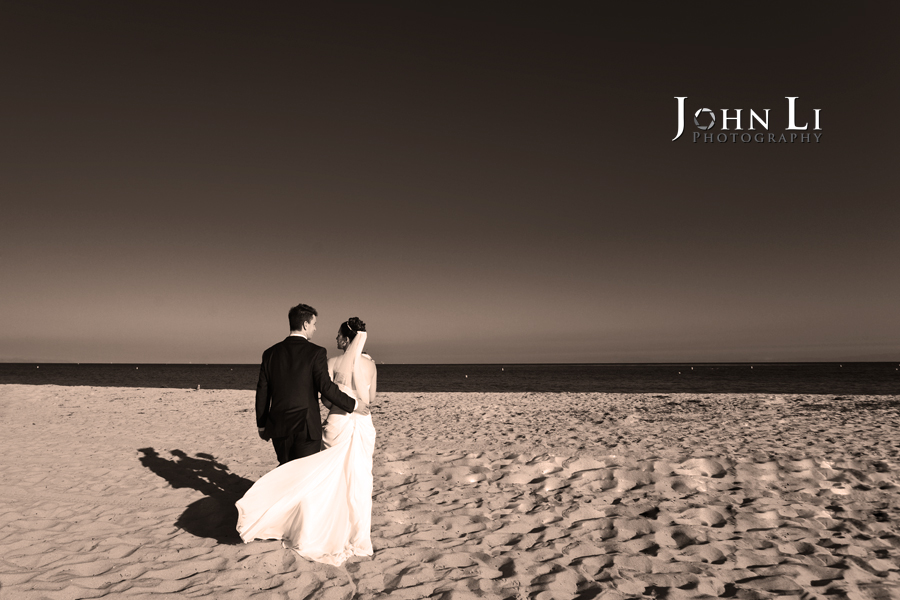 just married couple walk on the beach