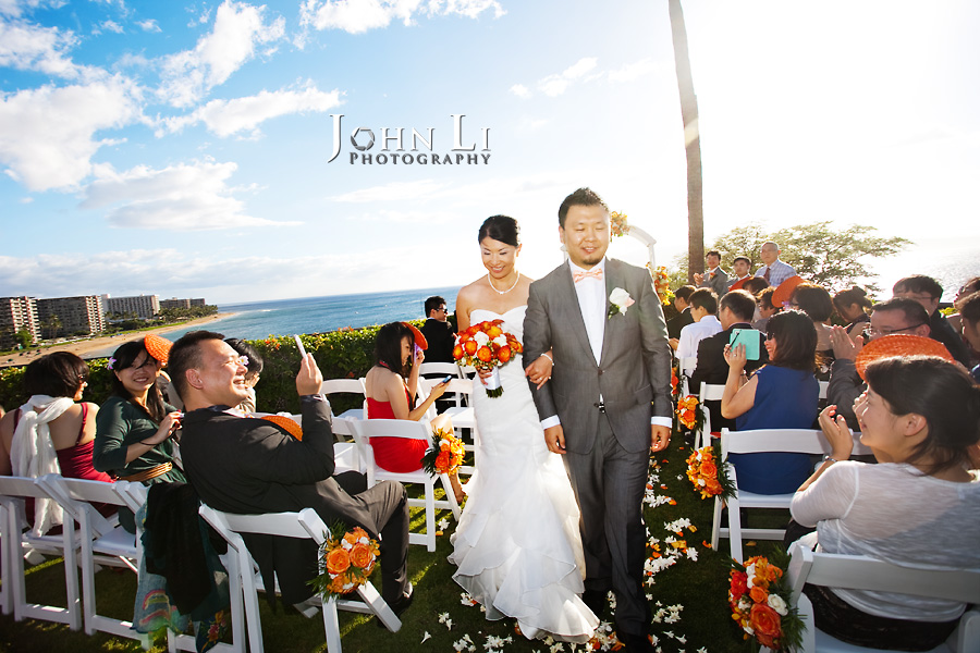 bride and groom walk down the aisel in Sheraton Maui wedding ceremony
